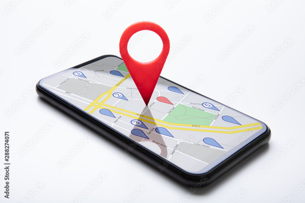 Poster cellphone with map pin pointer on white surface