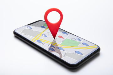 Cellphone With Map Pin Pointer On White Surface