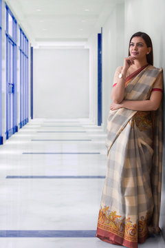 woman standing in the corridor and thinking	
