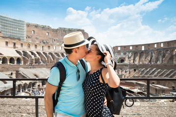 Young Couple Kissing Inside Of Colosseum