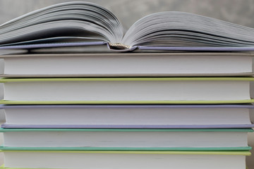 open book on stacks of books