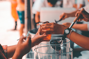 Charity food, Food for the poor hungry volunteers offering food to help the homeless : the idea of getting help from fellow humans