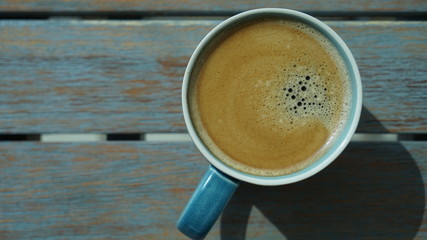 close up view on cup of coffee on table in cafe