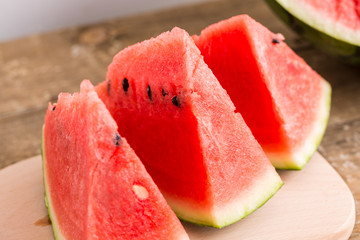 Slices of watermelon on wooden table, Closeup