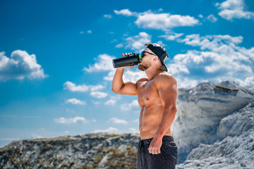 Man resting after training. Young man enjoying the nature during rest after training