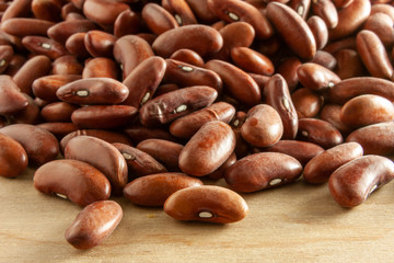 red kidney beans on wooden background
