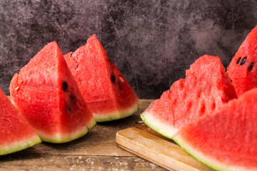 Slices of watermelon on wooden table