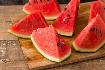 Slices of watermelon on wooden table