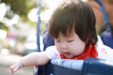 Cute asian Baby in a stroller