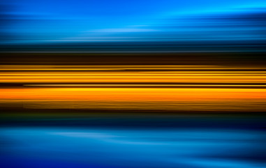 Abstract yellow light trails on the blue background