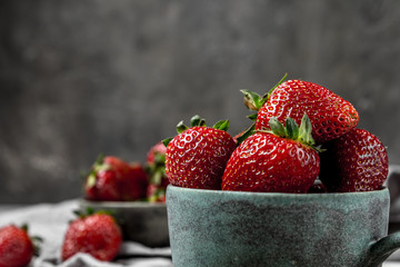 Soft focus of fresh ripe red strawberry in ceramic bowl