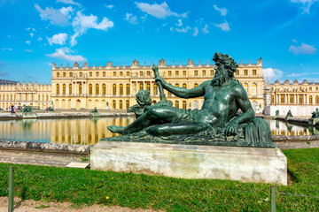 Fototapeta na wymiar Neptune statue and Versailles palace, Paris, France