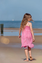 pretty girl walking on the beach