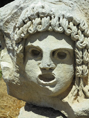 Fototapeta premium Bas-relief and stone sculpture of ancient Roman theater masks