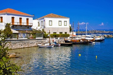 Fototapeta na wymiar The old harbor in Spetses island, Greece