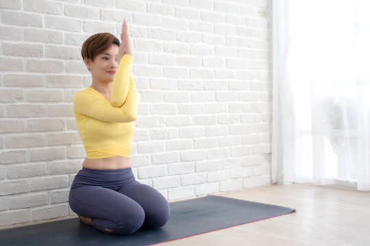 Asian woman doing yoga.