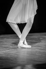 Legs of ballerina in ballet shoes, closeup