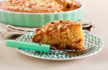 Slice of cake with nutty topping