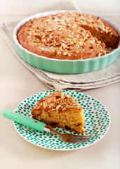 Slice of cake with nutty topping
