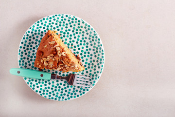 Slice of cake with nutty topping
