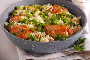 Chicken drumsticks with rice and peas