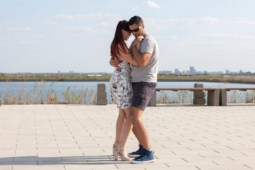 Kizomba, bachata, zouk and latin social dance concept - Man and woman dancing over nature background