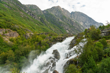 Fototapeta na wymiar Waterfall landscape, national park Jostedalsbreen, Norway