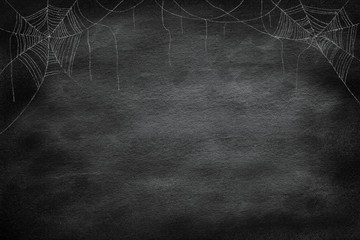 drawing group of spider web at the corner  on retro vintage chalkboard  background for halloween...