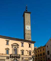 Fototapeta premium Ancient stone clock tower in the public square in the old town of Viterbo, Italy