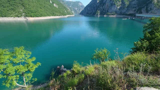 Fish in famous reservoir Piva Lake (Pivsko Jezero), summer view in Montenegro.