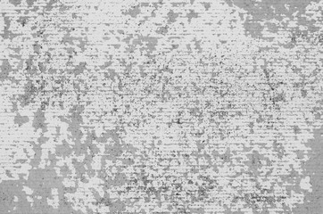 Abstract gray background of scratched slate surface closeup.
