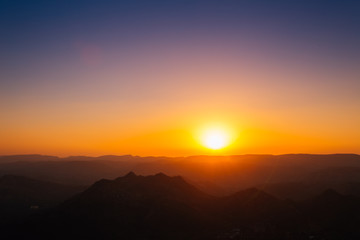 Dramatic sunset mountains landscape from Monsoon Palace in Udaipur, India