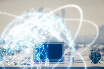 Double exposure of business theme icons and work space with computer background. Concept of success.