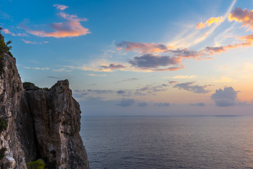 Greece, Zakynthos, Perfect red sunset sky over the cliffs and endless ocean water horizon