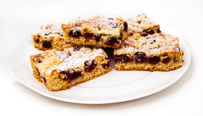 Slice of cherry Crumb cake on a dessert plate
