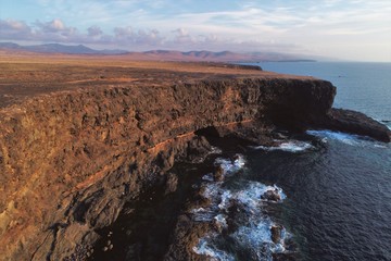 walk through a beautiful landscape with the sunset between the sky the sea and the land