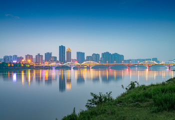 Naklejka premium Min River Bridge and City View, Leshan City, Sichuan Province, China
