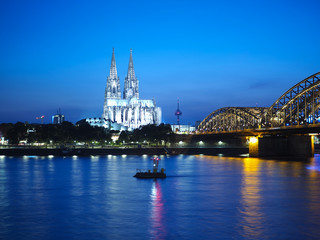 St Peter Cathedral and Hohenzollern Bridge over river Rhine in K