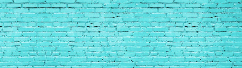 Pastel blue brick wall wide panoramic texture. Bright turquoise painted old brickwork widescreen background