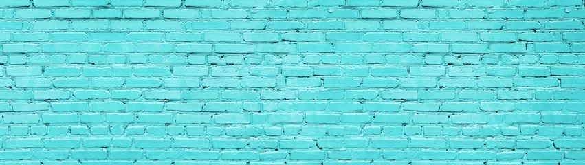 Pastellblaue Backsteinmauer breite Panoramastruktur. Hell türkis gestrichener alter Mauerwerkshintergrund mit großem Bildschirm © JAYANNPO
