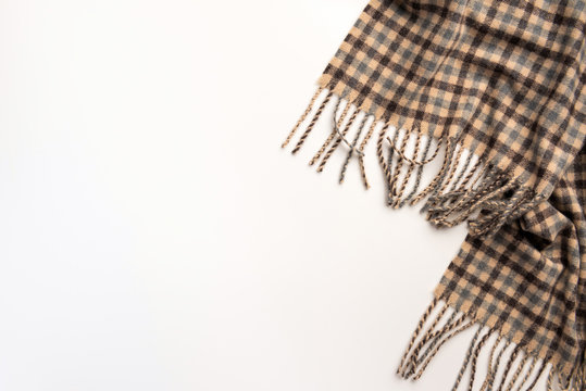 Warm scarf isolated on white background. Flat lay.