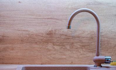 Water tap with sink in modern kitchen