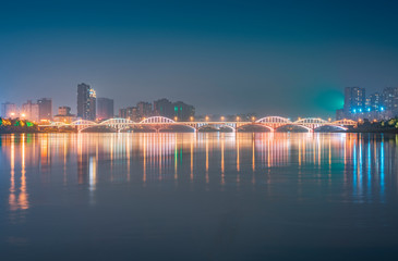 Fototapeta na wymiar Min River Bridge and City View, Leshan City, Sichuan Province, China