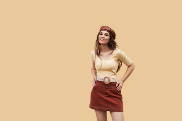 Young beautiful girl dressed in retro vintage style in the old european city