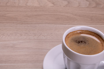 cup of coffee on wooden table