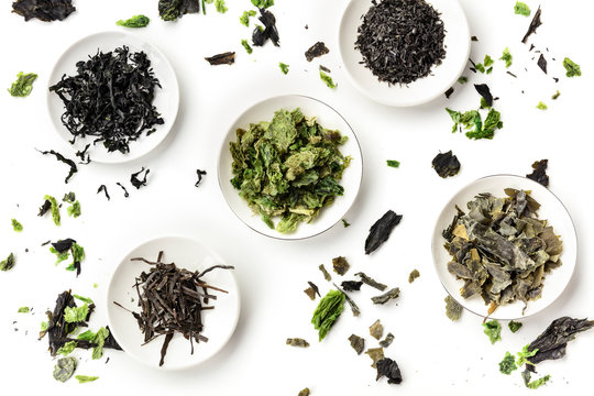 Various dry seaweed, sea vegetables, shot from the top on a white background. Superfoods background