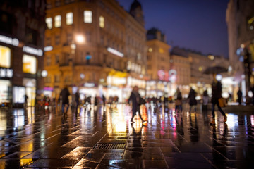 Fototapeta na wymiar crowd of people walking on night streets in the city