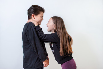 little girl and boy laughing
