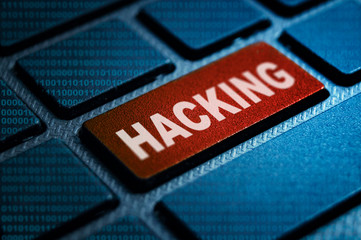 hacking keyword on laptop keyboard technology photography