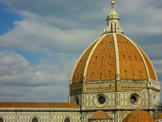 Obraz premium Florence Cathedral, Italy. Basilica of Santa Maria del Fiore (Duomo di Firenze) and bell tower (Giotto's Campanile) on the piazza del Duomo. Ornate marble facade of building exterior.